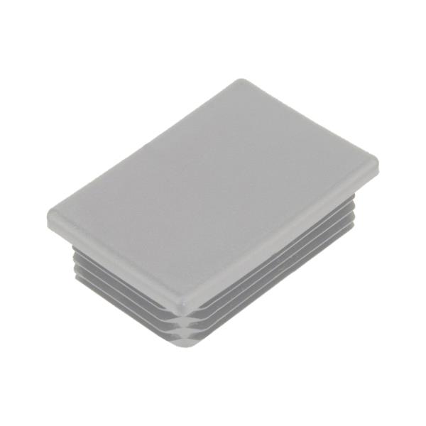 Žebrovaná obdélníková plastová zátka - plochá 60x40 mm, žebrování 1-3 mm, šedá erodovaná